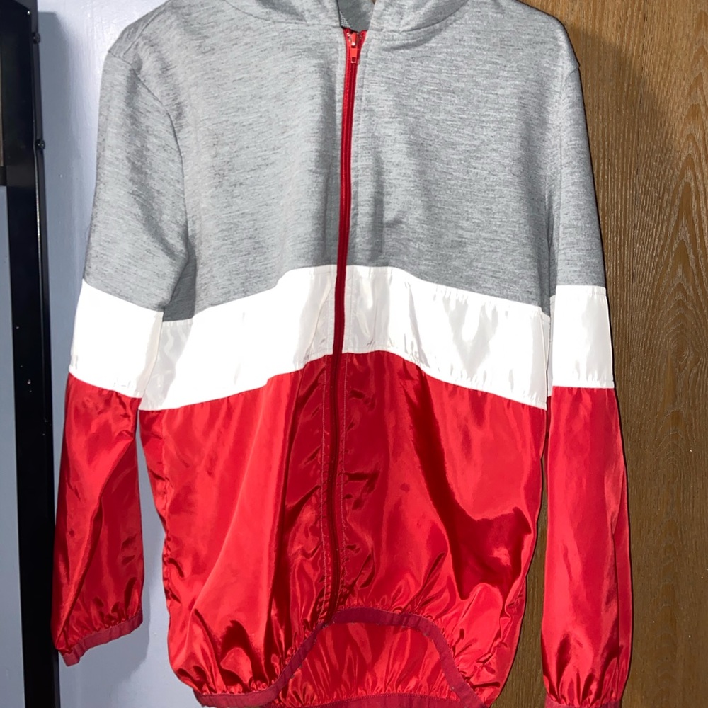 Red, white, and grey windbreaker